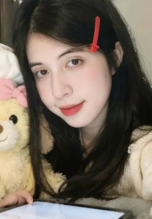 Meow from Vietnam, laughing during a video call after a good opener