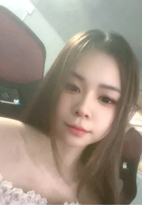Sun from Vietnam smiling, a portrait from a GirlChat live video call